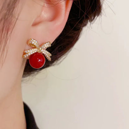 Rhinestone Bow Pearl Studs